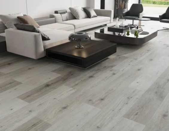 Grey luxury vinyl tile (LVT) flooring installed in a modern living room