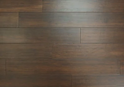 Top-down background view of dark espresso bamboo flooring planks