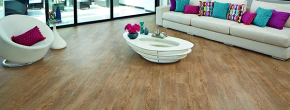 Warm oak luxury vinyl tile (LVT) flooring installed in a contemporary living room